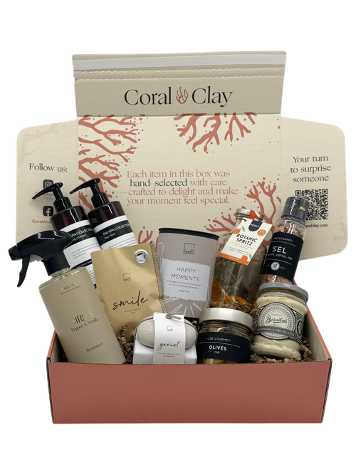Coral & Clay corporate gift box with bottles, jars and premium wellness products on a white background