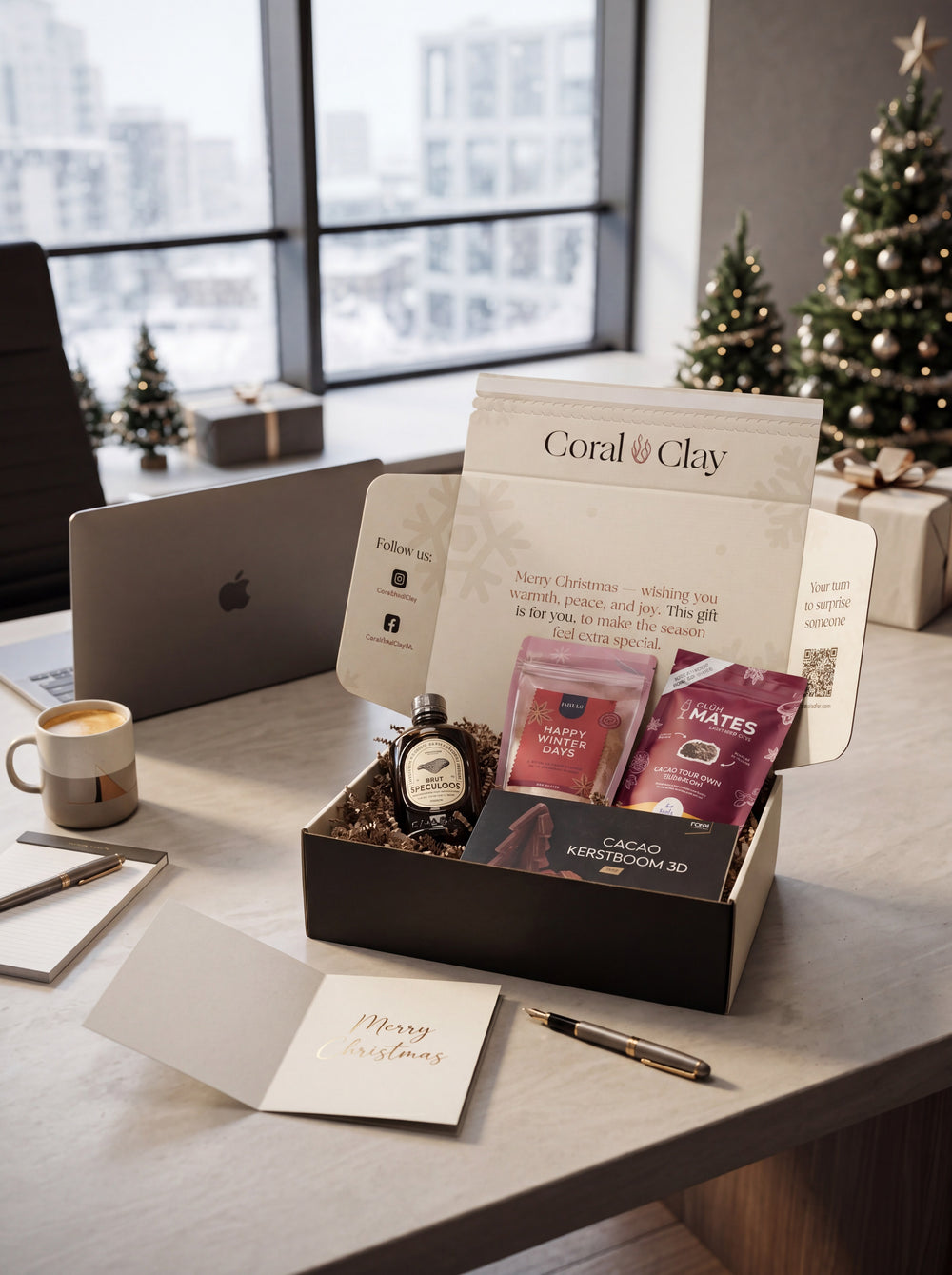 Coral & Clay Christmas corporate gift box with premium products displayed in a festive office setting