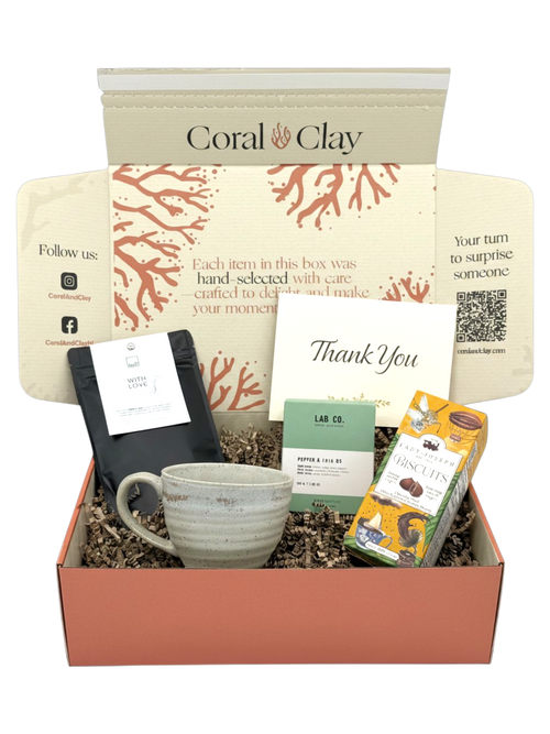 Thank You Gift box with a mug, tea, and other items with 'Coral & Clay' branding.
