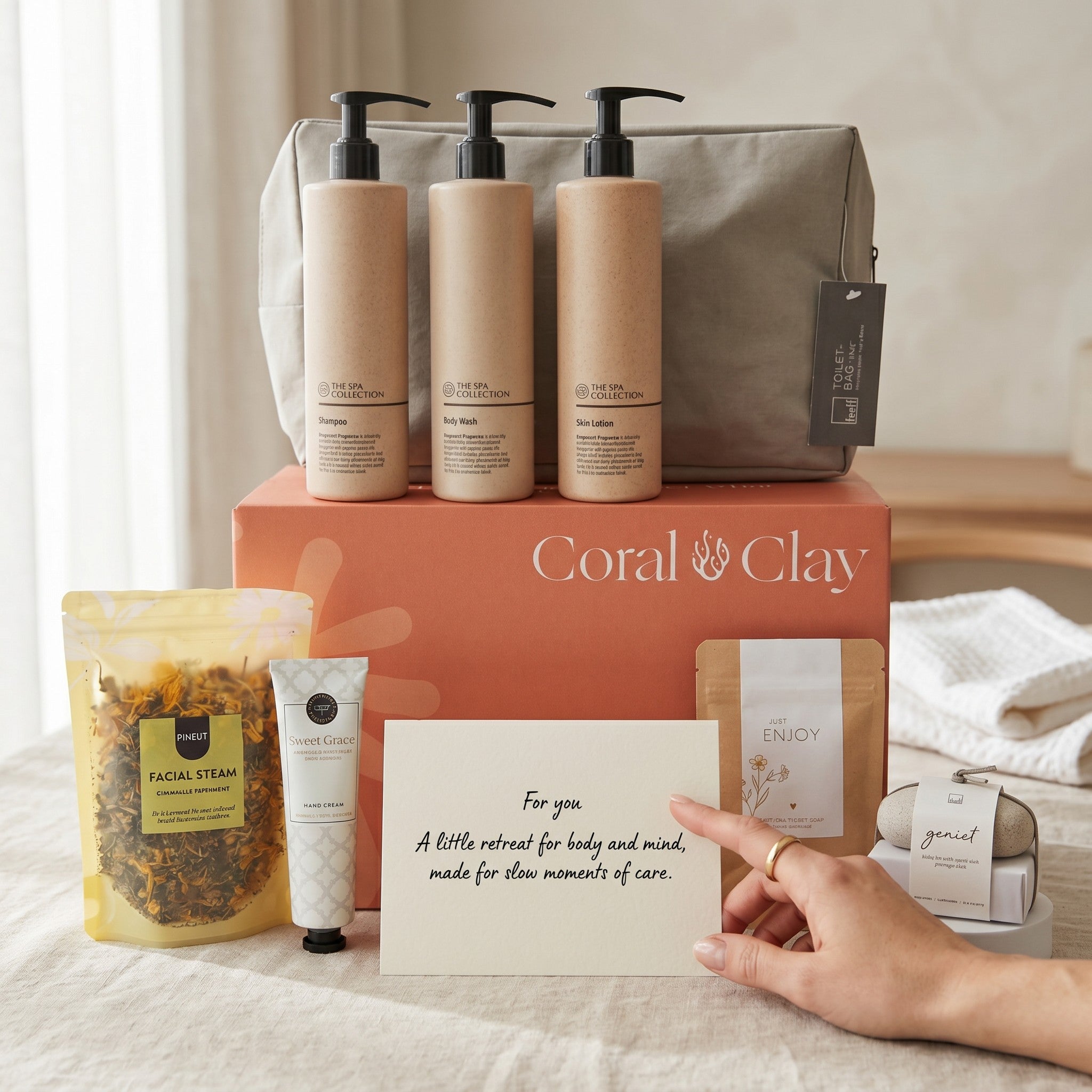 Coral & Clay bath retreat product set with a hand holding a card on a bed.