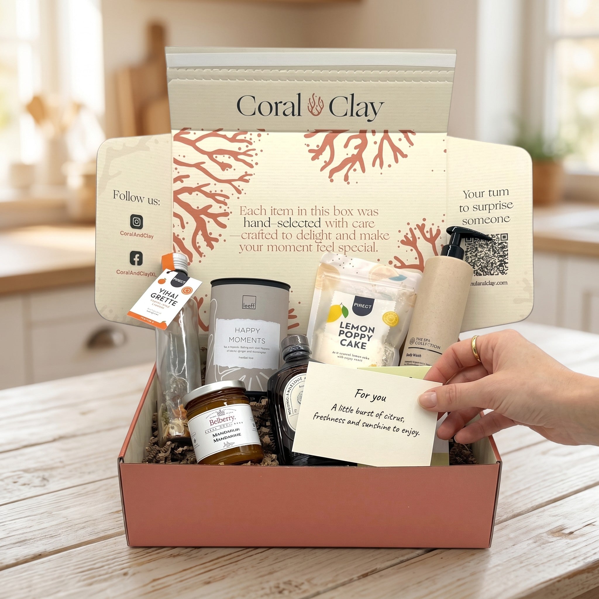 Citrus Zest Signature Gift staged shot with yuzu syrup, bergamot body wash, ginger lemongrass tea, mandarin marmalade, lemon poppy cake mix, pepper & orange vinaigrette and lemon salt candle.