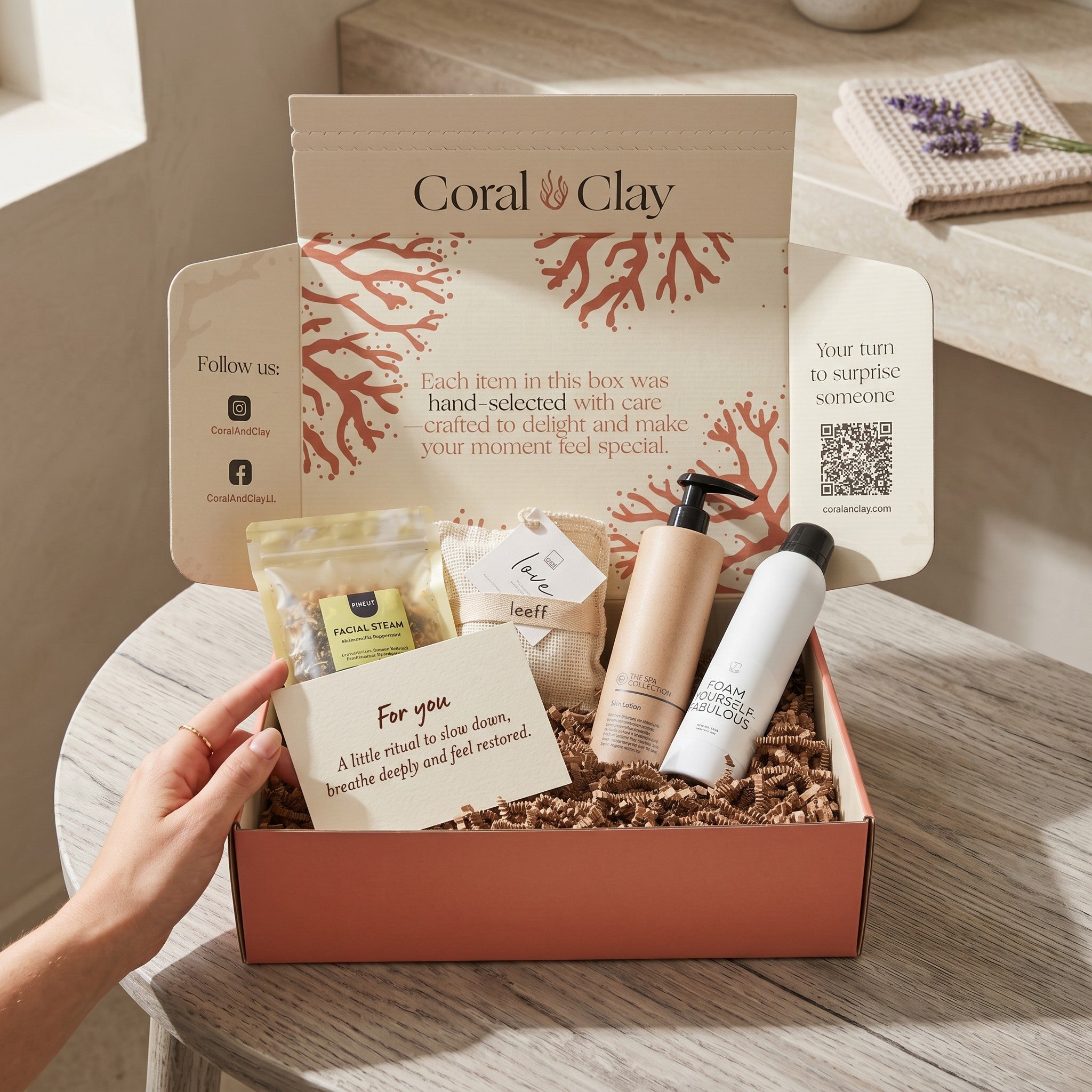 Coral Clay product set on a wooden surface with a hand reaching towards it.