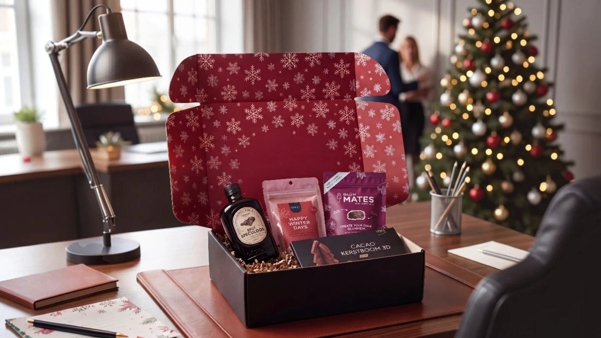 Corporate Christmas gift box with speculoos, winter tea, mulled wine spices and chocolate in snowflake packaging