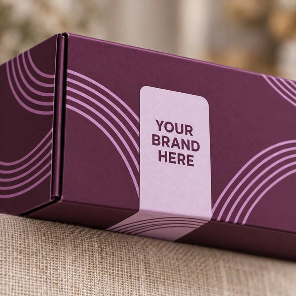 Custom logo sealing label on a purple branded gift box with a lilac wave pattern