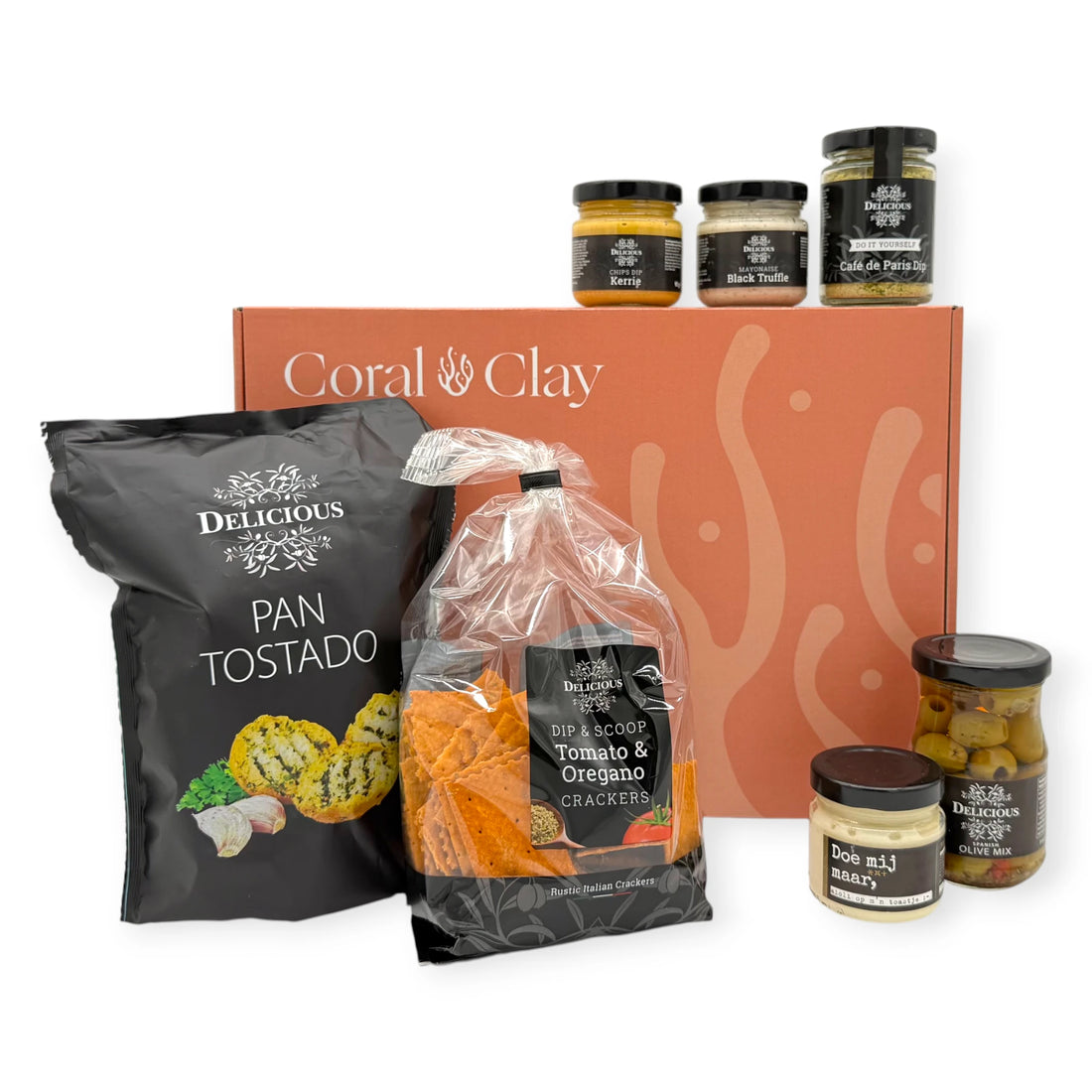 Dutch Borrel Signature Gift — hero setup featuring Pan Tostado, Tomato & Oregano Crackers, dips, and olives in front of the Coral & Clay signature gift box.