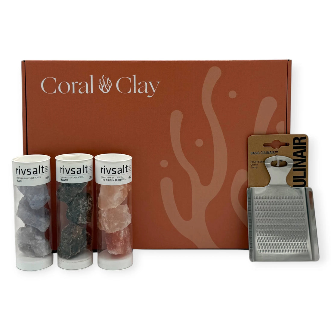 Rivsalt Crystal Colours Signature Gift Box by Coral & Clay, showing three Rivsalt salt rock tubes and a stainless-steel grater arranged in front of the premium coral-coloured gift box.
