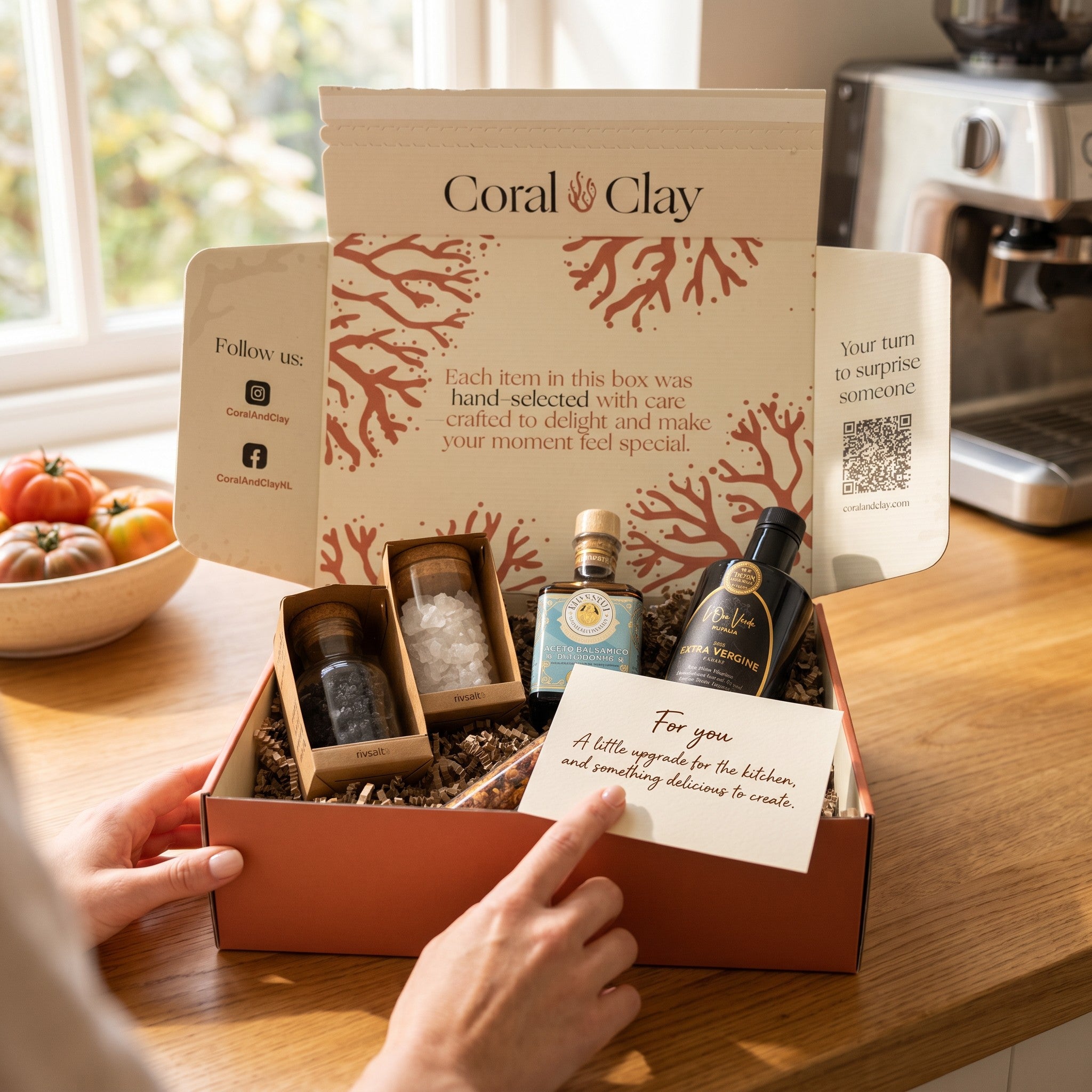 Coral & Clay Premium Kitchen Essentials Signature Gift lifestyle photo – top-down view on a kitchen counter with Mussini Modena balsamic vinegar, Oliva D’Oro olive oil, Rivsalt Pasta Salt rocks, Amazon Chili and Java Long Pepper.