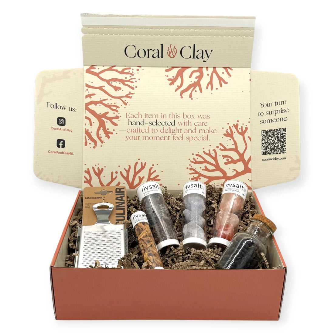 Coral & Clay Signature Spiceworks Gift Box with Rivsalt salt rock tubes, Amazon chili tube, whole spice jar, and stainless-steel grater arranged in front of the terracotta gift box.
