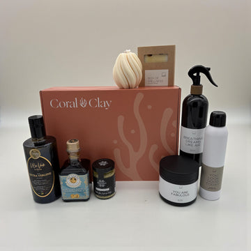 Collection of skincare and wellness products with a Coral & Clay signature gift box on a white background